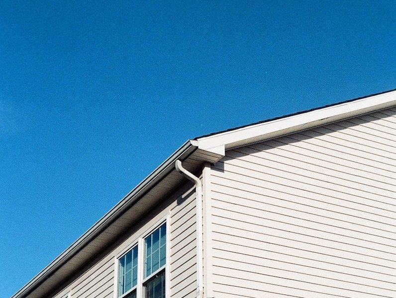 white wooden house under blue sky during daytime